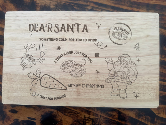 Wooden cutting board with Christmas-themed design and Jack Daniel's branding.